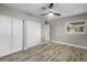 Well-lit bedroom featuring wood-look floors and closet at 6602 S Emerson Ave, St Petersburg, FL 33707