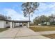 Modern home with a covered carport and a spacious driveway at 6602 S Emerson Ave, St Petersburg, FL 33707