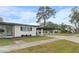 Ranch home with carport and well-manicured lawn at 6602 S Emerson Ave, St Petersburg, FL 33707