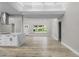 Modern kitchen with white shaker cabinets, quartz countertops, and stainless steel appliances at 6602 S Emerson Ave, St Petersburg, FL 33707