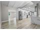 Open concept kitchen with white cabinets and stainless steel appliances at 6602 S Emerson Ave, St Petersburg, FL 33707