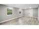 Light and airy living room with wood-look floors and access to backyard at 6602 S Emerson Ave, St Petersburg, FL 33707