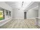 Spacious living area with vaulted ceiling and hardwood floors at 6602 S Emerson Ave, St Petersburg, FL 33707