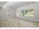 Bright living area with hardwood floors and vaulted ceiling at 6602 S Emerson Ave, St Petersburg, FL 33707