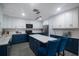 Modern kitchen with blue cabinets and large island at 1009 Black Knight Dr, Valrico, FL 33594