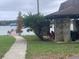 Lakeside pavilion with seating and grilling area at 1009 Black Knight Dr, Valrico, FL 33594