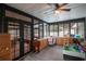 Spacious sunroom with multiple windows and wood flooring at 1009 Black Knight Dr, Valrico, FL 33594