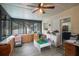 Sunroom features built-in cabinets and a view of the kitchen at 1009 Black Knight Dr, Valrico, FL 33594