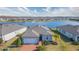 Aerial view of a single-Gathering home with solar panels and a lake view at 19494 Sea Glass Cir, Land O Lakes, FL 34638