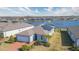 Aerial view of a house with a lake in the background at 19494 Sea Glass Cir, Land O Lakes, FL 34638