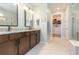 Bathroom boasts a double vanity and large walk-in closet at 19494 Sea Glass Cir, Land O Lakes, FL 34638