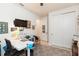Bedroom with a home office setup and double doors at 19494 Sea Glass Cir, Land O Lakes, FL 34638