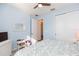 Light blue bedroom with double doors and patterned bedding at 19494 Sea Glass Cir, Land O Lakes, FL 34638