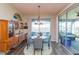 Bright dining room with lake views and seating for four at 19494 Sea Glass Cir, Land O Lakes, FL 34638