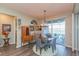 Charming dining room with lake views and antique buffet at 19494 Sea Glass Cir, Land O Lakes, FL 34638