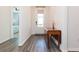 Bright entryway with wood-look floors and a drop leaf table at 19494 Sea Glass Cir, Land O Lakes, FL 34638