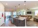 Modern kitchen with island, stainless steel appliances, and granite countertops at 19494 Sea Glass Cir, Land O Lakes, FL 34638