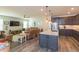 Open concept kitchen and living room with hardwood floors at 19494 Sea Glass Cir, Land O Lakes, FL 34638