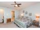 Main bedroom with king-size bed and ensuite bathroom at 19494 Sea Glass Cir, Land O Lakes, FL 34638