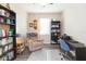 Home office with a comfortable chair, desk, and bookshelves at 19494 Sea Glass Cir, Land O Lakes, FL 34638
