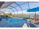Inviting screened pool with lake view and spacious deck at 19494 Sea Glass Cir, Land O Lakes, FL 34638