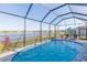 Beautiful screened pool with a tranquil lake view at 19494 Sea Glass Cir, Land O Lakes, FL 34638