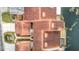 Aerial view of condo building showcasing red tile roofs and waterfront access at 3076 Braeloch E Cir # 5, Clearwater, FL 33761