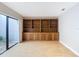 Versatile den with built-in shelving and hardwood floors at 3076 Braeloch E Cir # 5, Clearwater, FL 33761