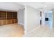 Bright hallway with tile floors and views into an adjacent room at 3076 Braeloch E Cir # 5, Clearwater, FL 33761
