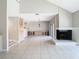 Bright living room with fireplace and sliding glass doors leading to a patio at 3076 Braeloch E Cir # 5, Clearwater, FL 33761