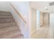 Staircase with carpeted steps and wooden handrail at 3076 Braeloch E Cir # 5, Clearwater, FL 33761