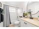 Clean bathroom with a tub shower, toilet, and vanity at 5226 Bonita Dr, Wimauma, FL 33598