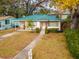 Charming single story home with green metal roof at 728 Bay St, Dunedin, FL 34698