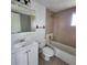 Bathroom with a bathtub, toilet and vanity at 7304 Dianne Dr, New Port Richey, FL 34652