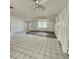Living room with tile and vinyl flooring, and a window at 7304 Dianne Dr, New Port Richey, FL 34652