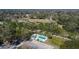 Aerial view showing community pool and surrounding landscape at 9402 Forest Hills Cir, Tampa, FL 33612