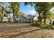Spacious backyard with mature trees and landscaping at 9402 Forest Hills Cir, Tampa, FL 33612