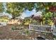 Backyard garden with various plants and a pond at 9402 Forest Hills Cir, Tampa, FL 33612
