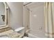Clean bathroom with granite countertop, bathtub, and shower at 9402 Forest Hills Cir, Tampa, FL 33612