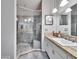 Bathroom with double vanity, large shower, and granite countertop at 9402 Forest Hills Cir, Tampa, FL 33612