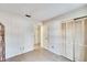 Bedroom with door to hallway and closet at 9402 Forest Hills Cir, Tampa, FL 33612