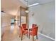 Dining area with four chairs and view into living room at 9402 Forest Hills Cir, Tampa, FL 33612