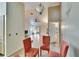 Bright dining area with four chairs and view into living room at 9402 Forest Hills Cir, Tampa, FL 33612