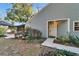 Gray house exterior with walkway and landscaping at 9402 Forest Hills Cir, Tampa, FL 33612