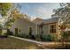 Gray house with walkway leading to the back door at 9402 Forest Hills Cir, Tampa, FL 33612