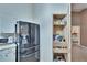 Kitchen boasts a refrigerator and pantry at 9402 Forest Hills Cir, Tampa, FL 33612