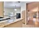Open kitchen with breakfast bar and view to living room at 9402 Forest Hills Cir, Tampa, FL 33612