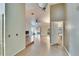 View of living room from kitchen with tile flooring at 9402 Forest Hills Cir, Tampa, FL 33612