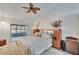 Spacious main bedroom with king-size bed and private access to the patio at 9402 Forest Hills Cir, Tampa, FL 33612