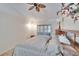 Main bedroom with king bed, ceiling fan and patio access at 9402 Forest Hills Cir, Tampa, FL 33612